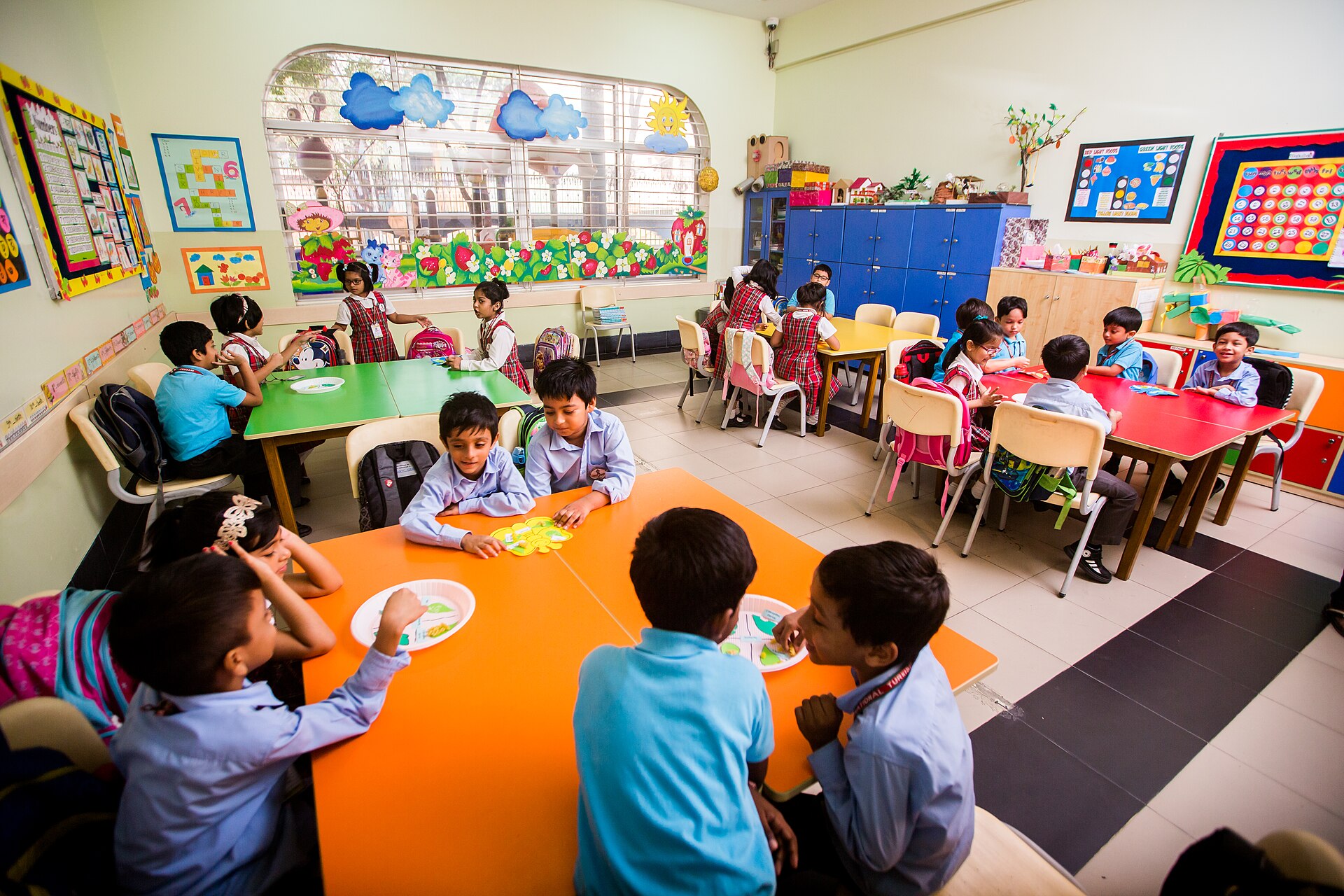 Children learning together in a bright, welcoming classroom in Bangladesh